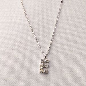 Beautiful letter E personal initial pendant and chain necklace.